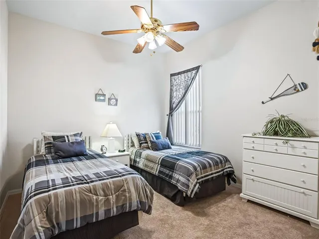 an aerial view of residential houses with outdoor space and swimming pool