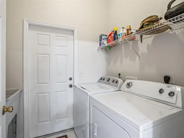 an aerial view of residential houses with outdoor space and river