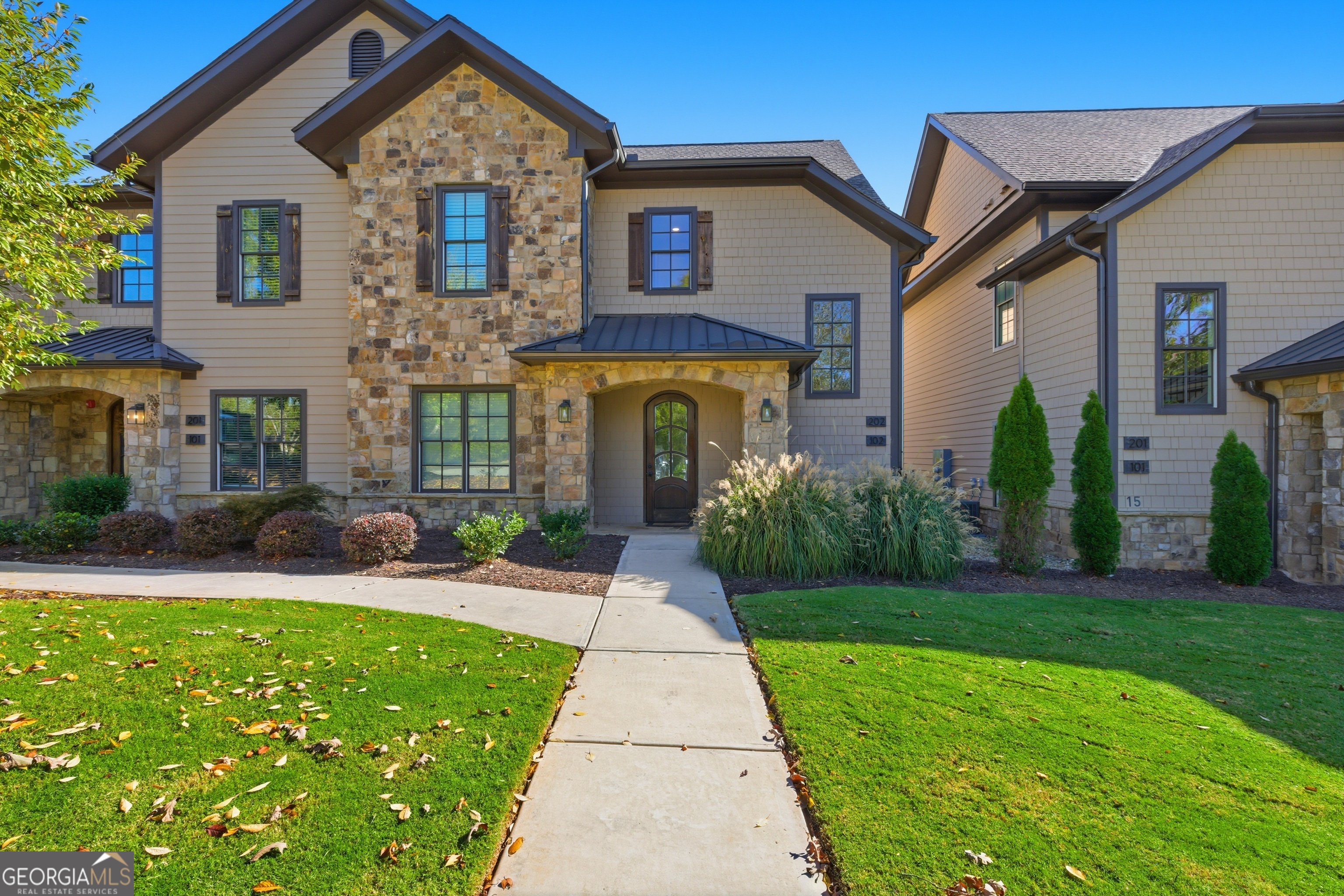 17 Cottage Lane, Unit 202 Toccoa, GA 30577 - Photo 1 of 43 a front view of a house with garden