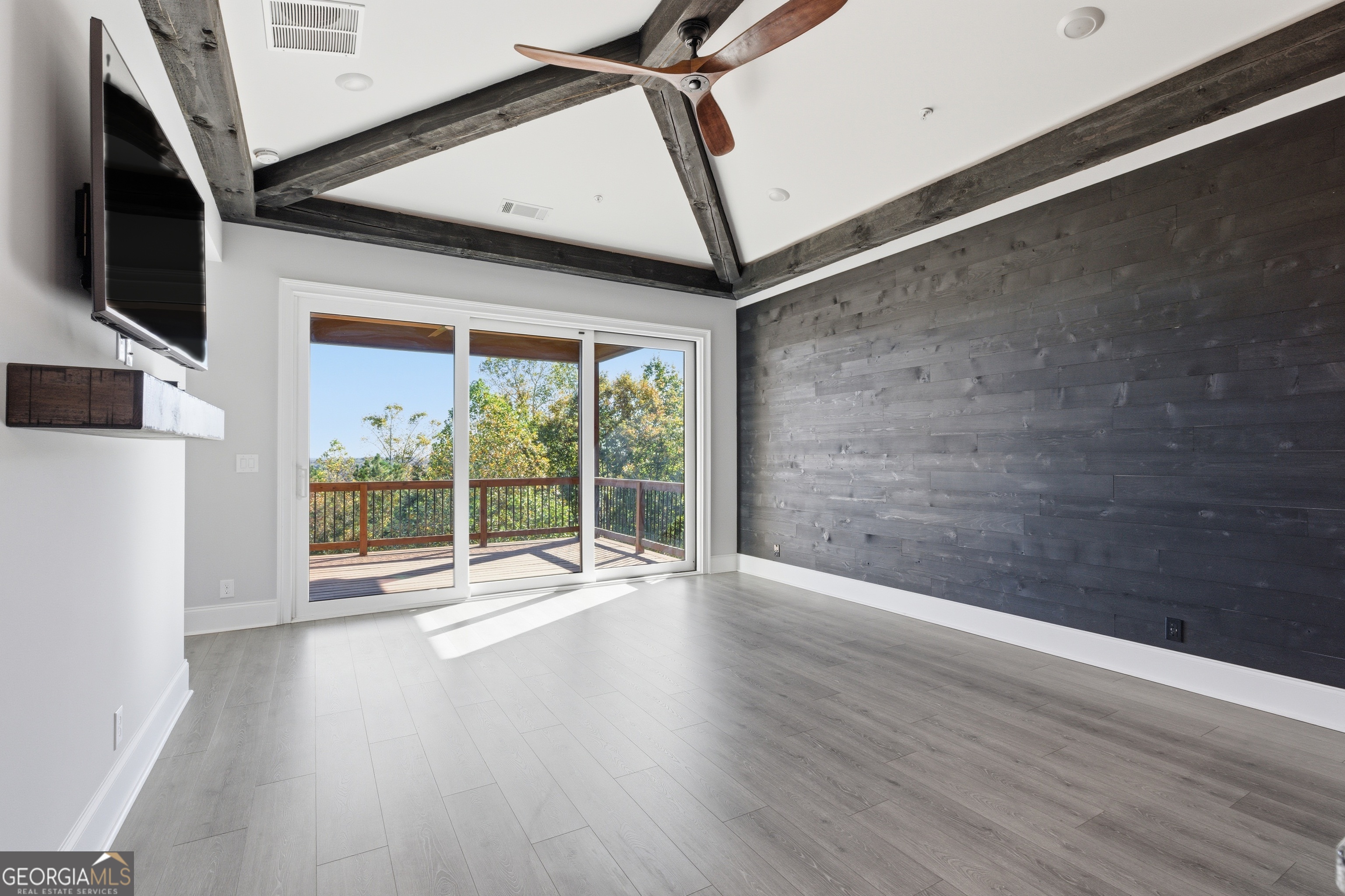 17 Cottage Lane, Unit 202 Toccoa, GA 30577 - Photo 11 of 43 a view of an empty room with wooden floor and a window