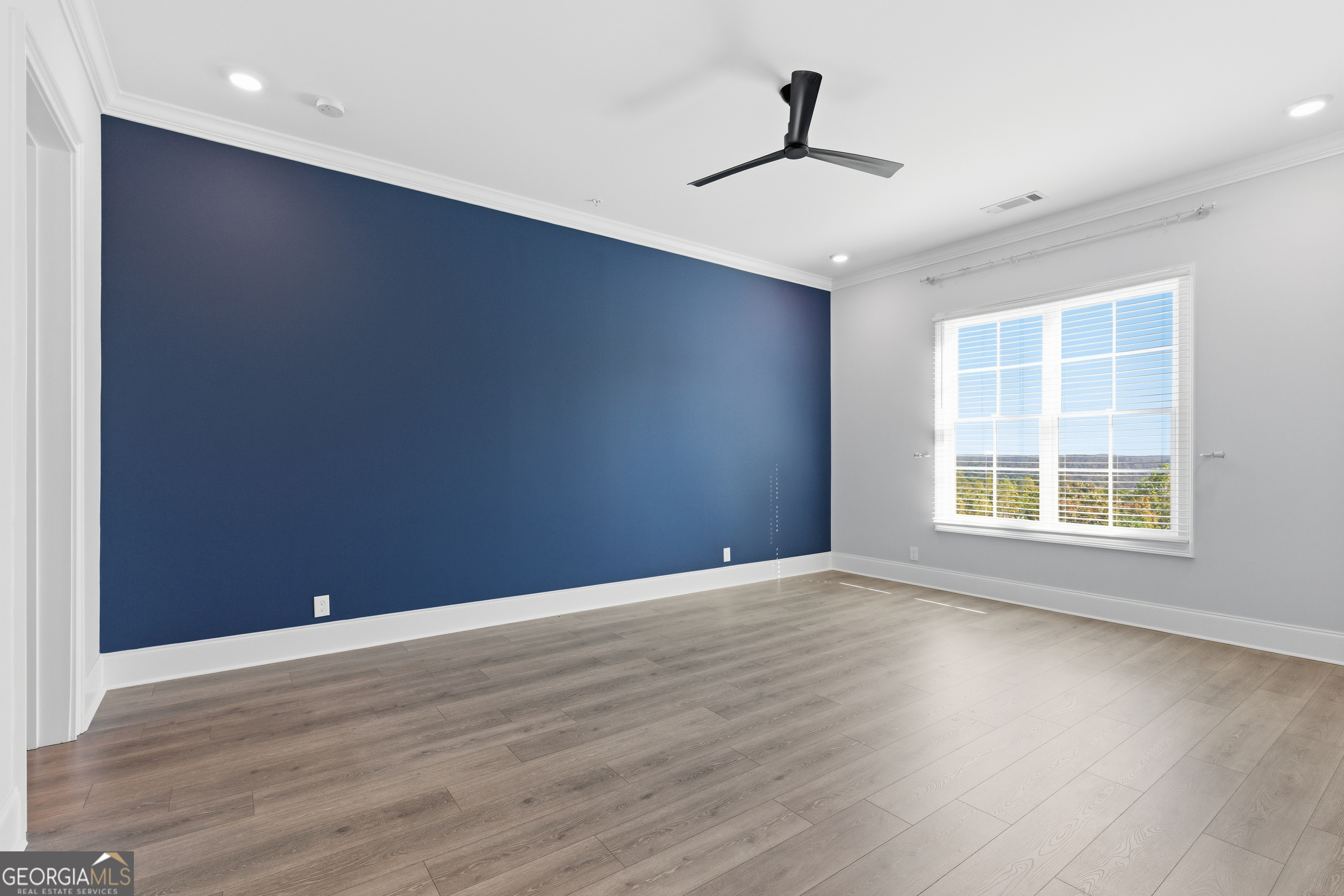 17 Cottage Lane, Unit 202 Toccoa, GA 30577 - Photo 14 of 43 a view of an empty room with wooden floor and a window