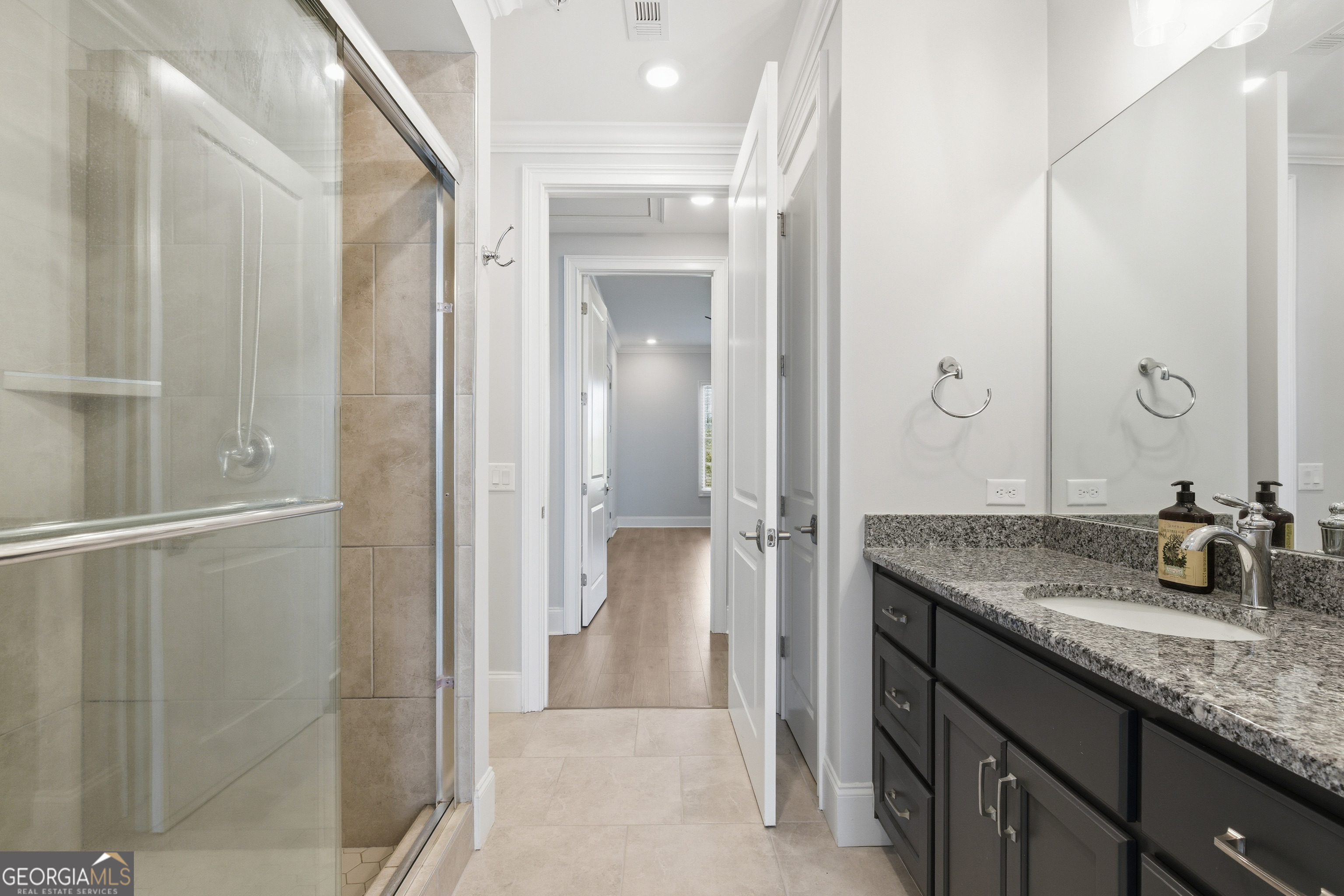 17 Cottage Lane, Unit 202 Toccoa, GA 30577 - Photo 18 of 43 a bathroom with a granite countertop sink and a mirror