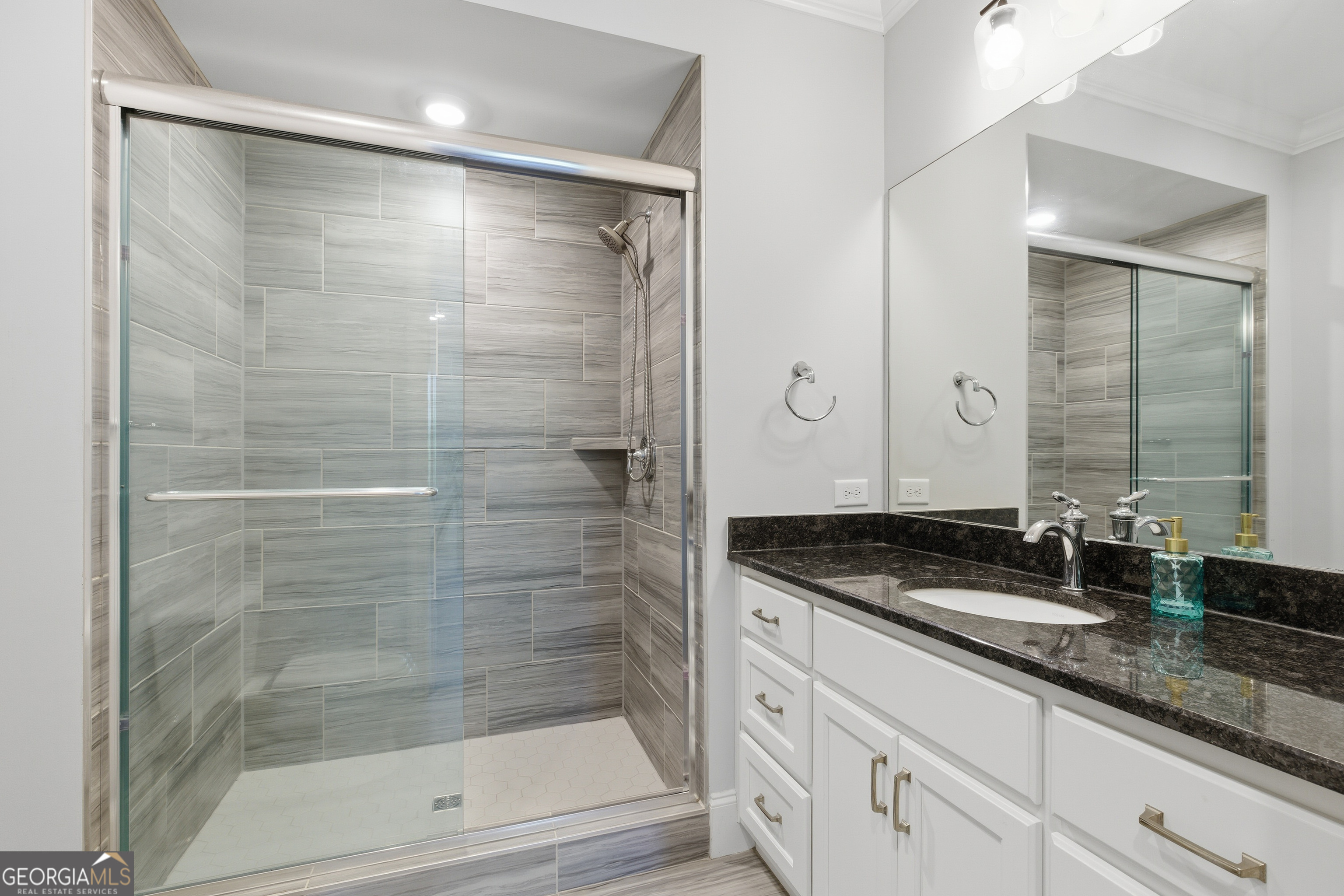 17 Cottage Lane, Unit 202 Toccoa, GA 30577 - Photo 25 of 43 a bathroom with a granite countertop sink a mirror and shower