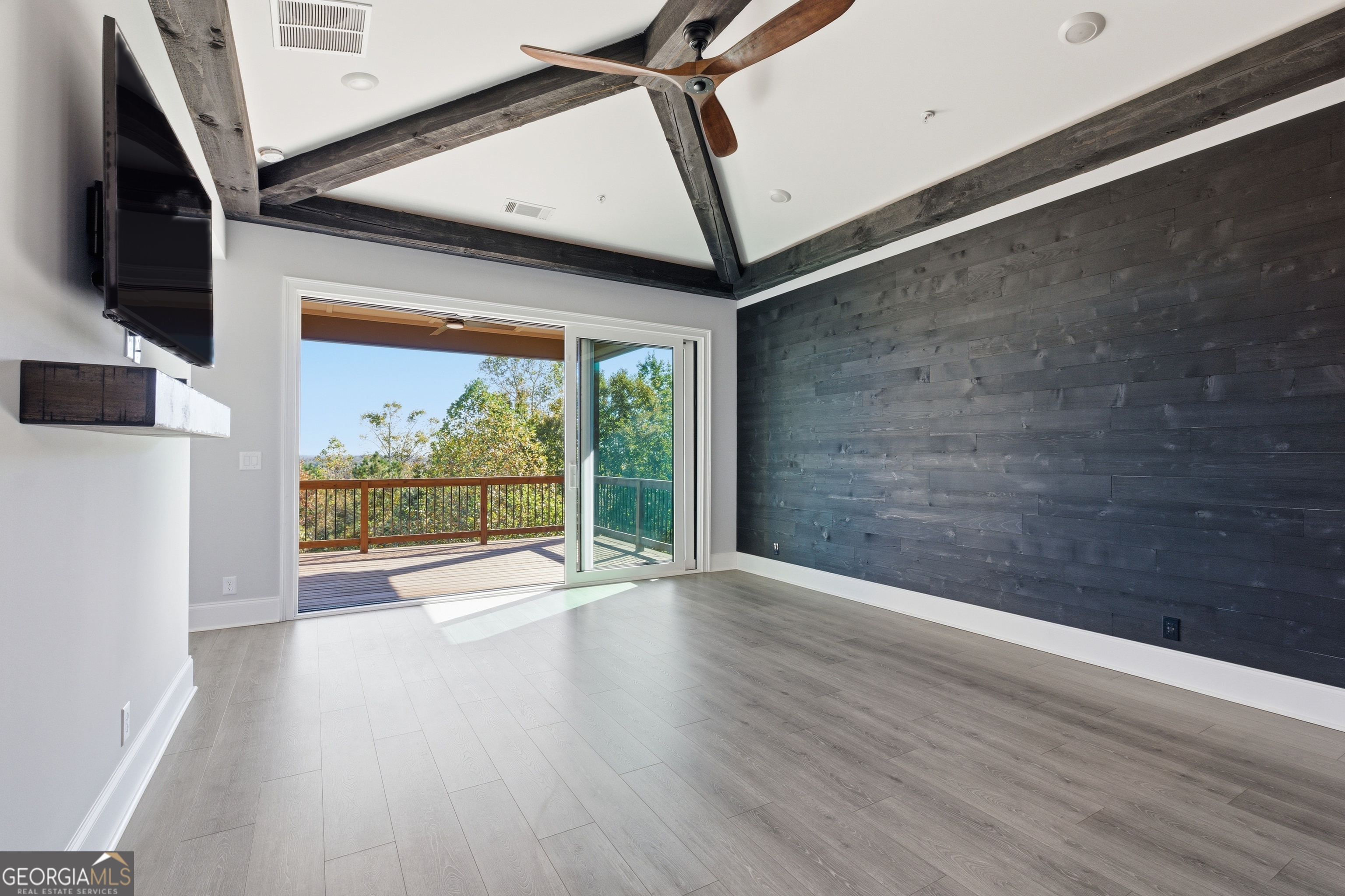 17 Cottage Lane, Unit 202 Toccoa, GA 30577 - Photo 27 of 43 a view of an empty room with wooden floor and a window