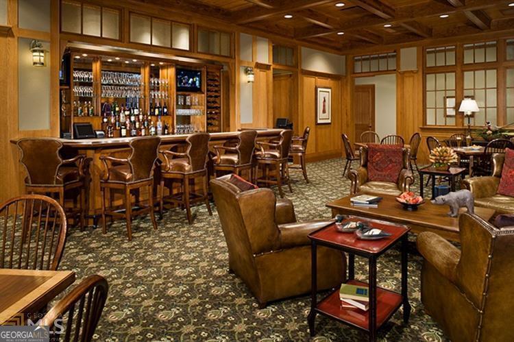 17 Cottage Lane, Unit 202 Toccoa, GA 30577 - Photo 43 of 43 a living room with lots of chairs and a chandelier