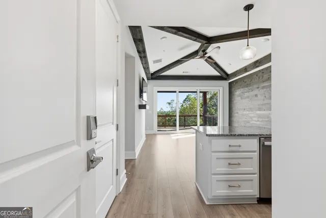 a view of a hallway to a bedroom
