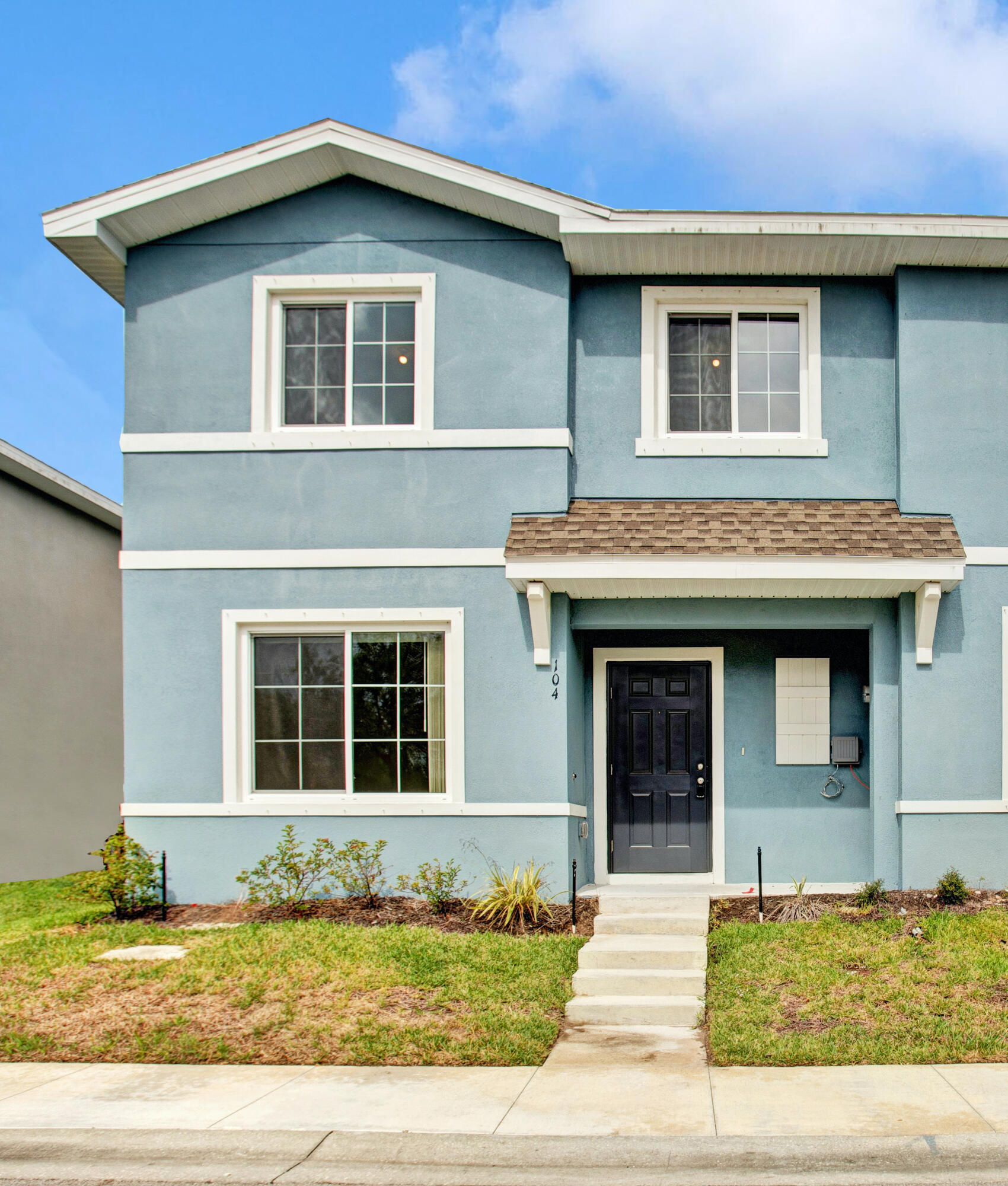 3343 Liberty Square Way, Unit 104 Fort Pierce, FL 34982 - Photo 1 of 34 a front view of a house
