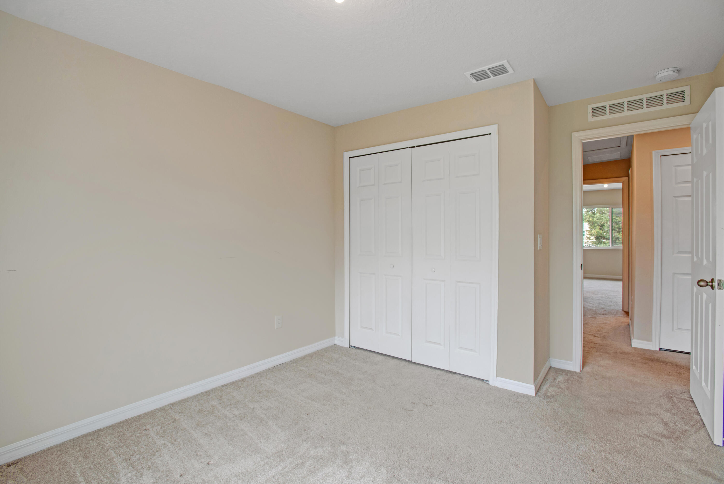 3343 Liberty Square Way, Unit 104 Fort Pierce, FL 34982 - Photo 18 of 34 an empty room with windows