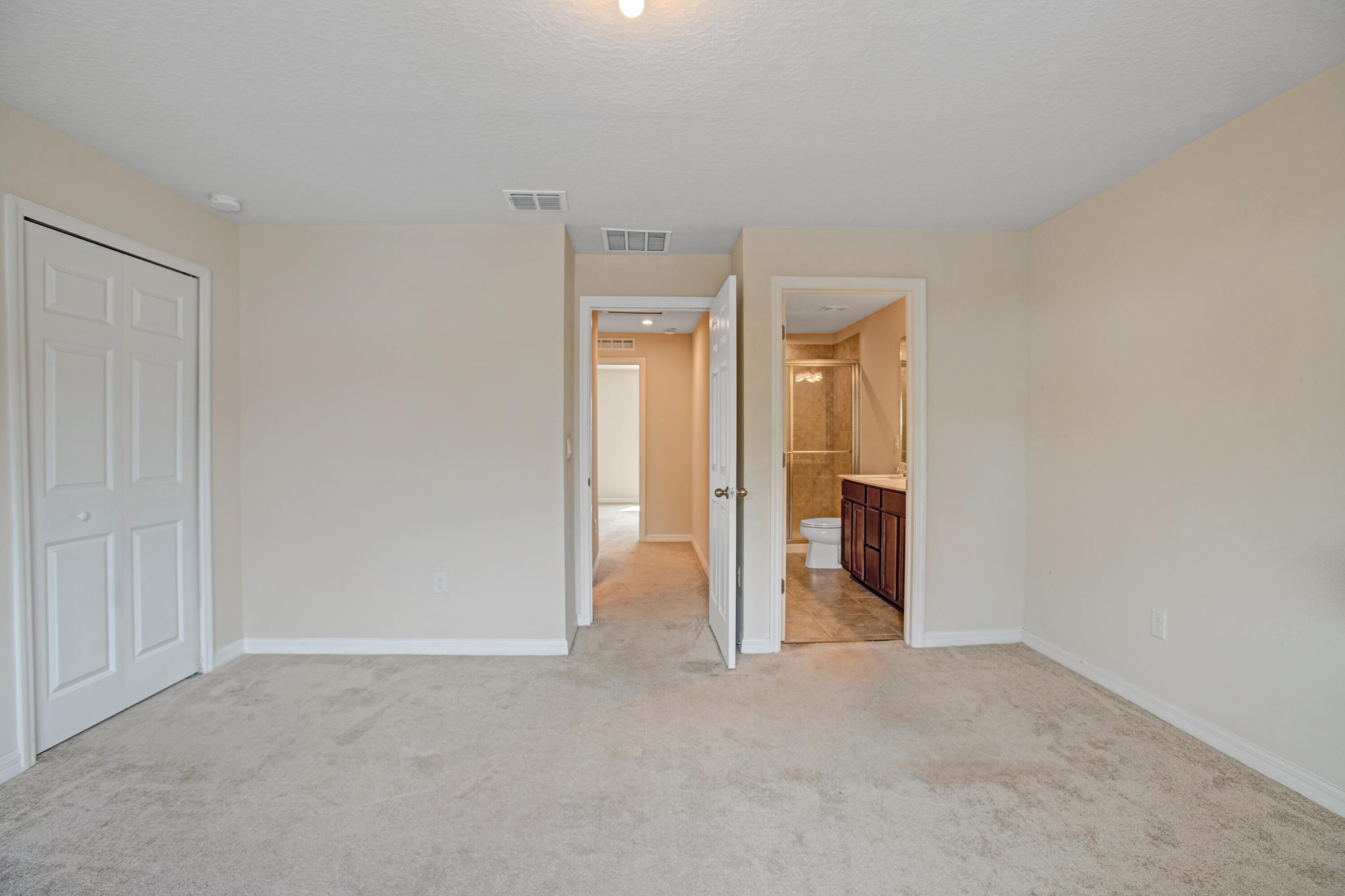 3343 Liberty Square Way, Unit 104 Fort Pierce, FL 34982 - Photo 23 of 34 a view of an empty room with a bathroom
