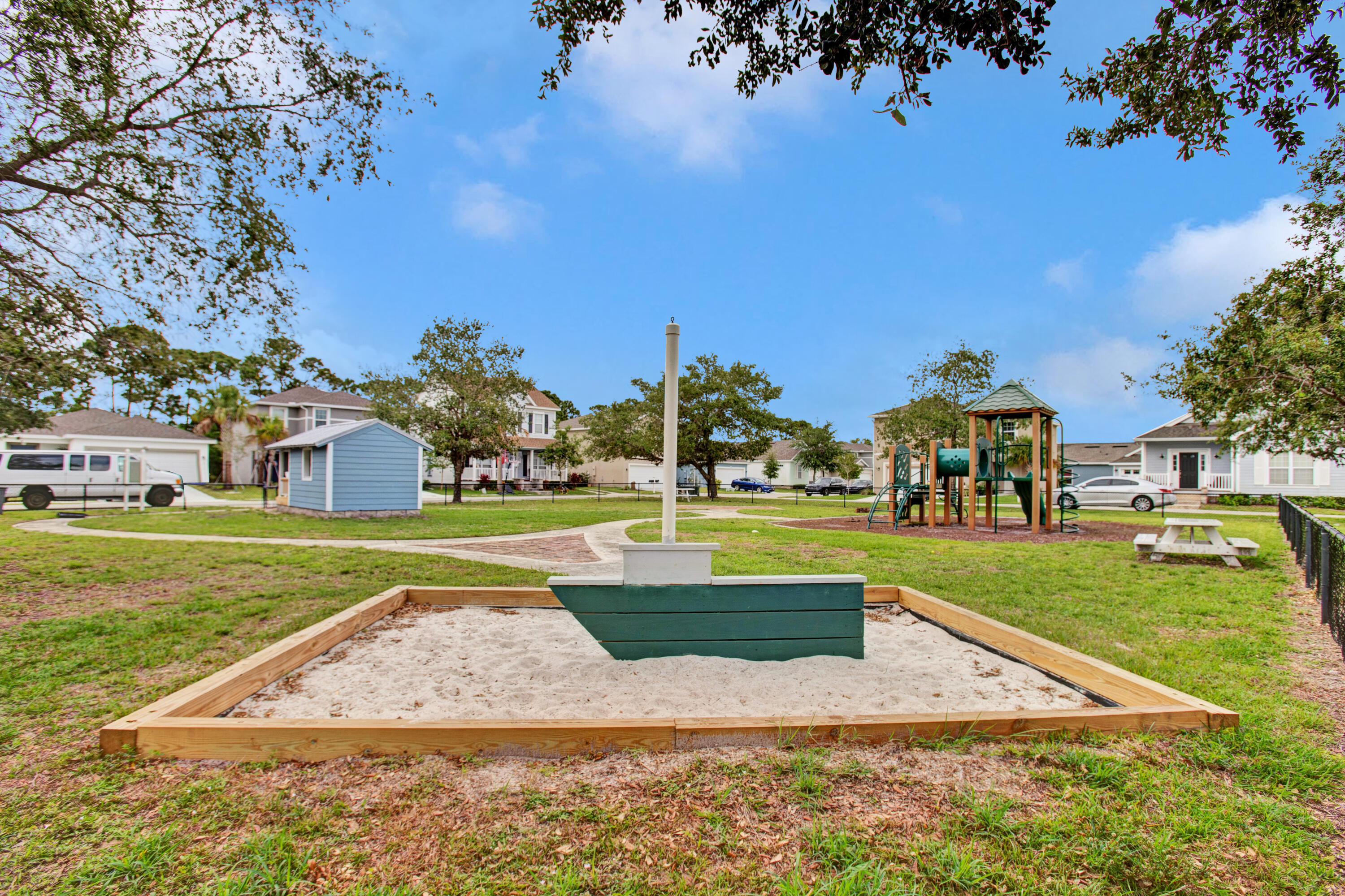 3343 Liberty Square Way, Unit 104 Fort Pierce, FL 34982 - Photo 28 of 34 a view of yard with swimming pool and green space