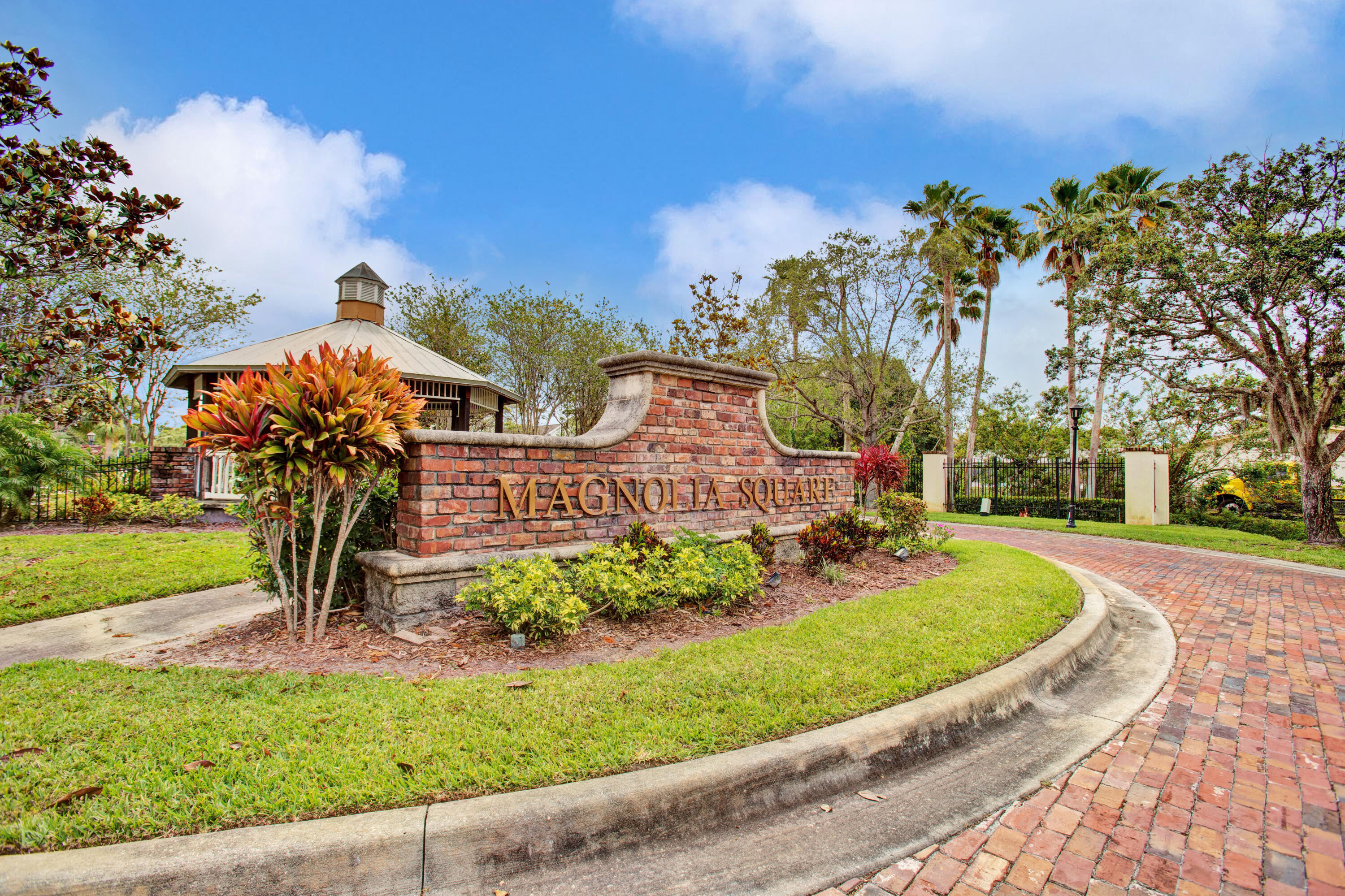 3343 Liberty Square Way, Unit 104 Fort Pierce, FL 34982 - Photo 3 of 34 front view of a house with a yard