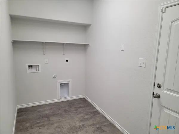 a stove top oven sitting inside of a kitchen