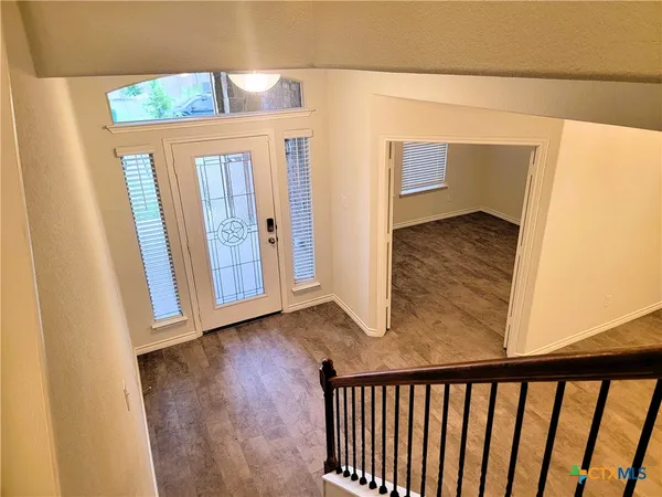 a view of a porch with wooden floor