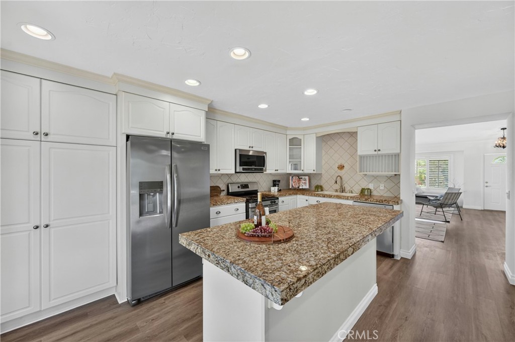 11562 Chadwick Road Corona, CA 92878 - Photo 6 of 39 Kitchen has plenty of storage, canned lighting and granite countertops.