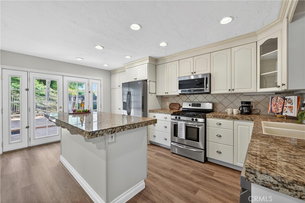 11562 Chadwick Road Corona, CA 92878 - Photo 7 of 39 Kitchen and french doors to backyard. Beautiful view