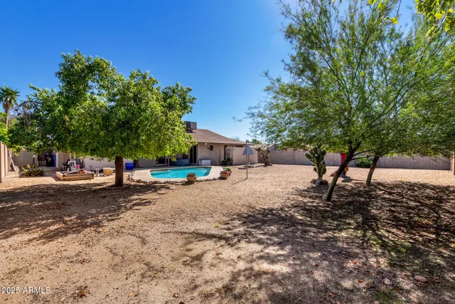 a view of a swimming pool with a patio
