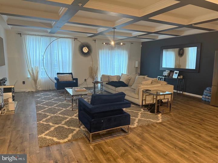 2805 Pinebrook Road, Unit 439 Landover, MD 20785 - Photo 13 of 36 a living room with furniture and a wooden floor