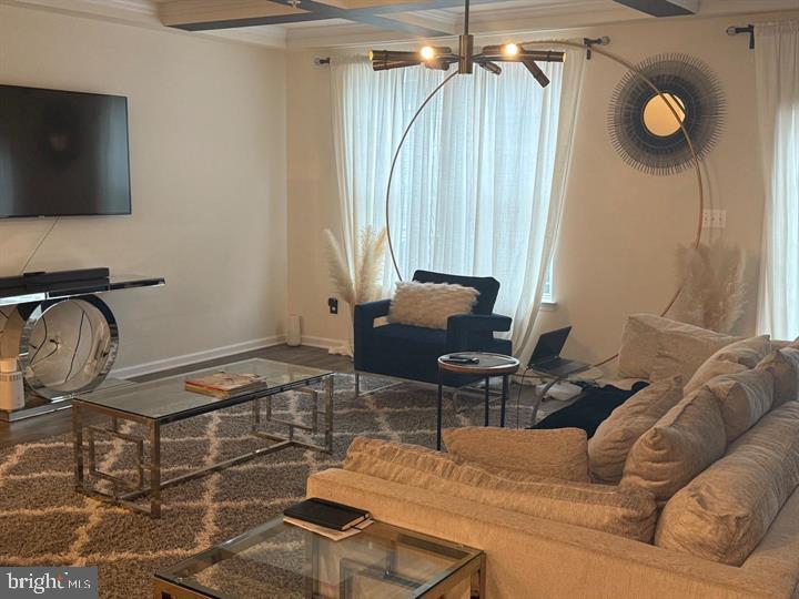 2805 Pinebrook Road, Unit 439 Landover, MD 20785 - Photo 18 of 36 a living room with furniture and a flat screen tv