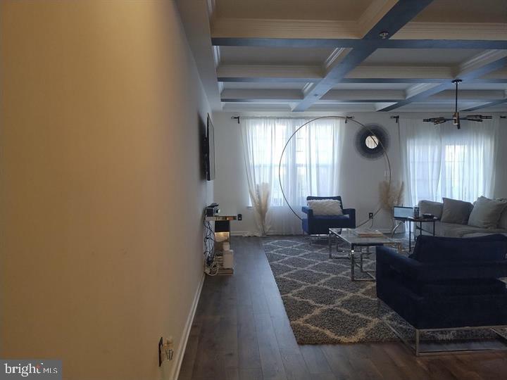 2805 Pinebrook Road, Unit 439 Landover, MD 20785 - Photo 19 of 36 a living room with furniture and a chandelier