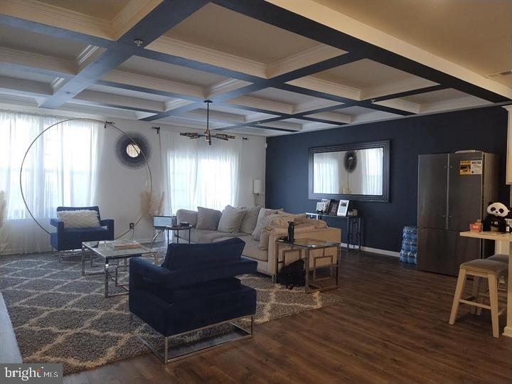2805 Pinebrook Road, Unit 439 Landover, MD 20785 - Photo 20 of 36 a living room with furniture and a wooden floor