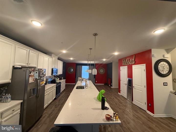2805 Pinebrook Road, Unit 439 Landover, MD 20785 - Photo 2 of 36 a large kitchen with stainless steel appliances lots of counter space