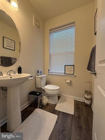 2805 Pinebrook Road, Unit 439 Landover, MD 20785 - Photo 25 of 36 a bathroom with a toilet sink and mirror