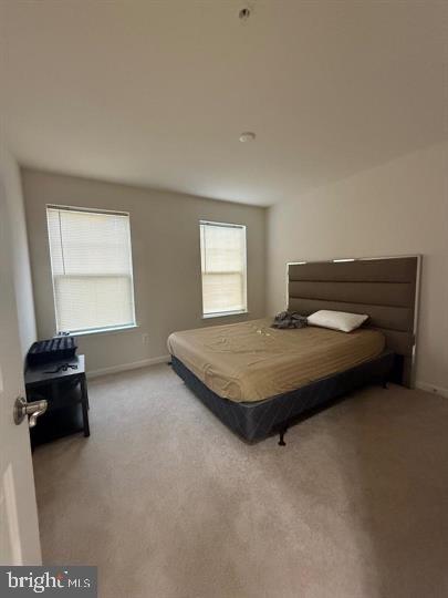 2805 Pinebrook Road, Unit 439 Landover, MD 20785 - Photo 28 of 36 a bedroom with a bed and a window