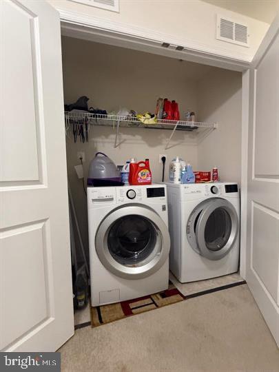2805 Pinebrook Road, Unit 439 Landover, MD 20785 - Photo 32 of 36 a utility room with dryer and washer