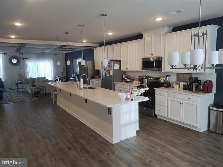 2805 Pinebrook Road, Unit 439 Landover, MD 20785 - Photo 6 of 36 a large white kitchen with lots of counter space a sink and appliances