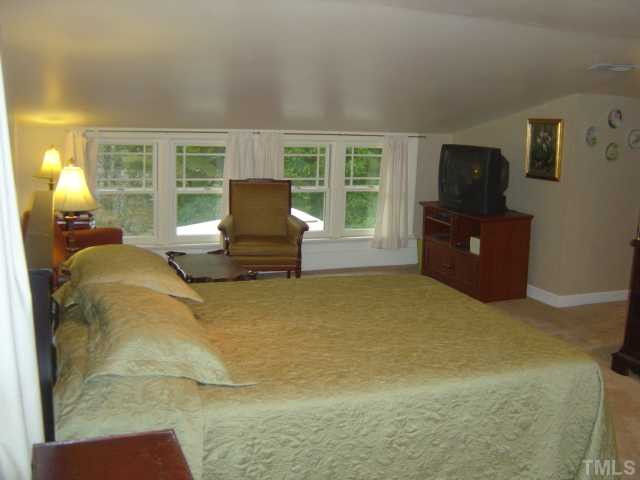 911 Brooks Avenue Raleigh, NC 27607 - Photo 10 of 12 Upstairs master is huge with sitting area as well as a computer desk area. Private bath with cedar-lined walk-in closet. Ceilings are 81" (3" shy of 7'). Nice big windows make the room feel special. Master Suite