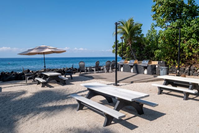 a view of a backyard with sitting area and furniture