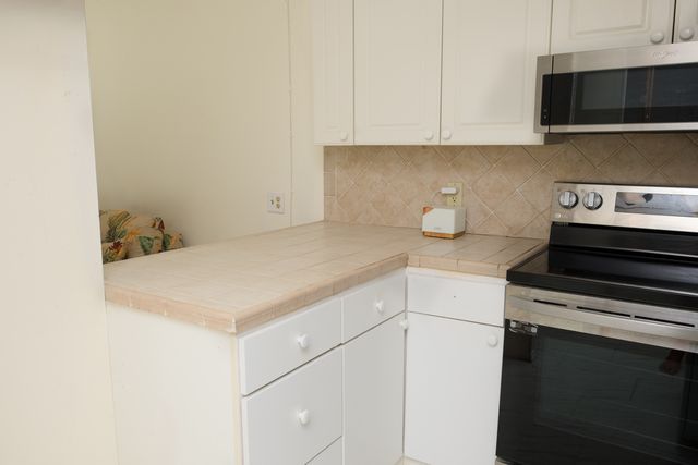 a kitchen with a stove and a microwave