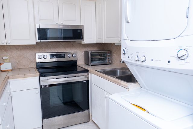 a kitchen with a stove and a microwave