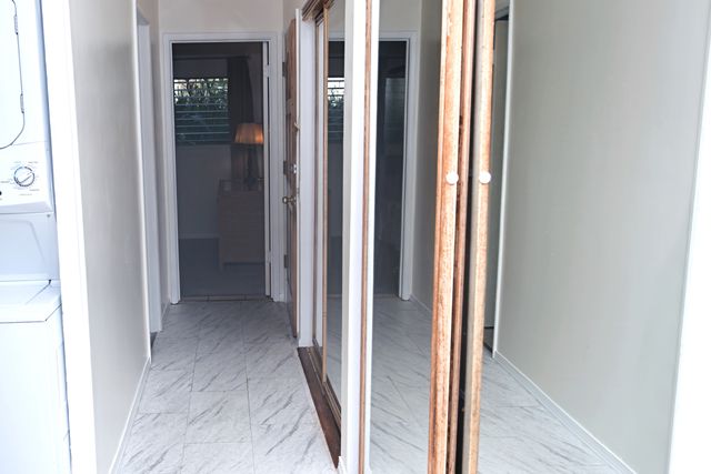 a view of a hallway with closet