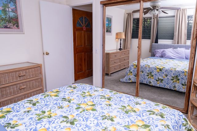 a bedroom with a bed and a dresser