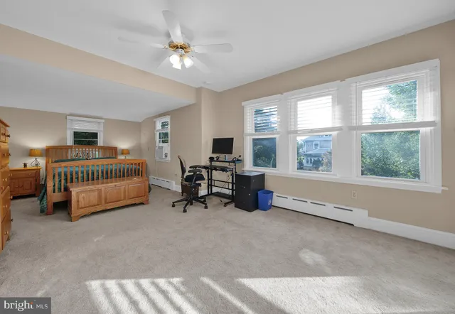 a bedroom with bed and a window