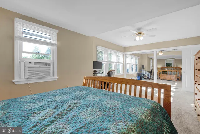 a bedroom with furniture and windows