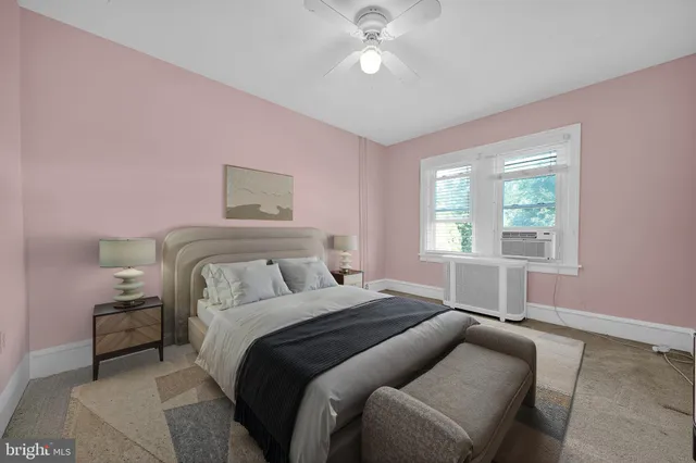 a bedroom with a bed and window