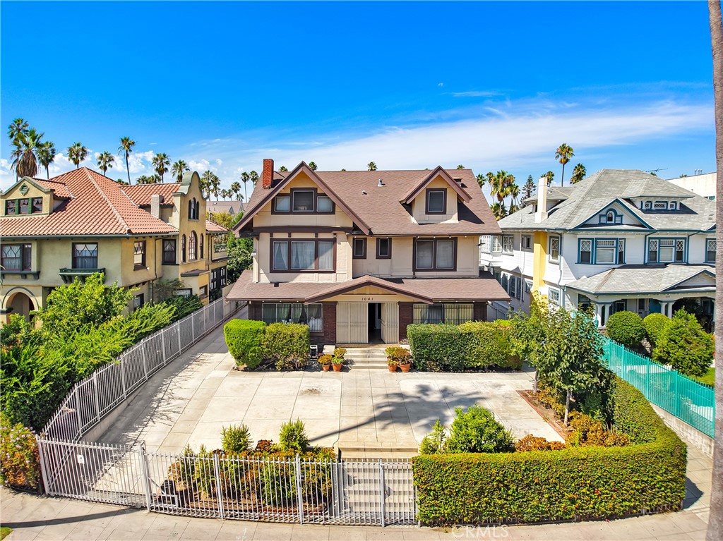 a front view of a residential houses with yard