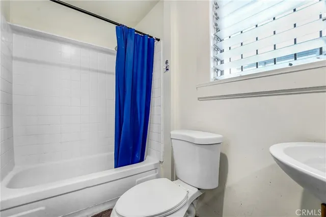 a view of storage and utility room with washer and dryer