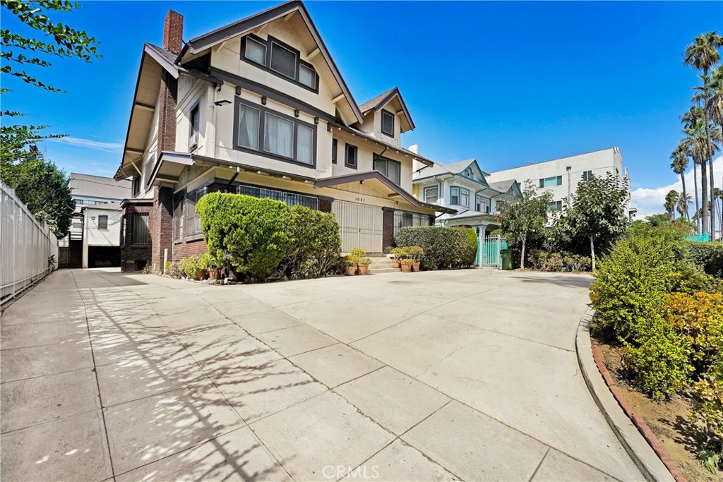 1041 Elden Avenue Los Angeles, CA 90006 - Photo 15 of 25 a front view of a house with a yard