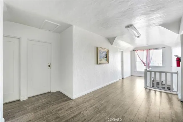 a view of an entryway with wooden floor
