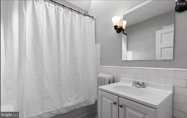 a bathroom with a sink and mirror
