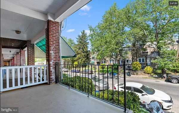 a view of a porch with a small yard