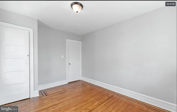 a view of room with wooden floor