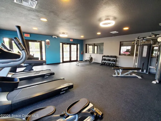 a view of a room with gym equipment