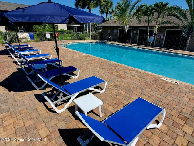 a view of an chairs and table in the patio
