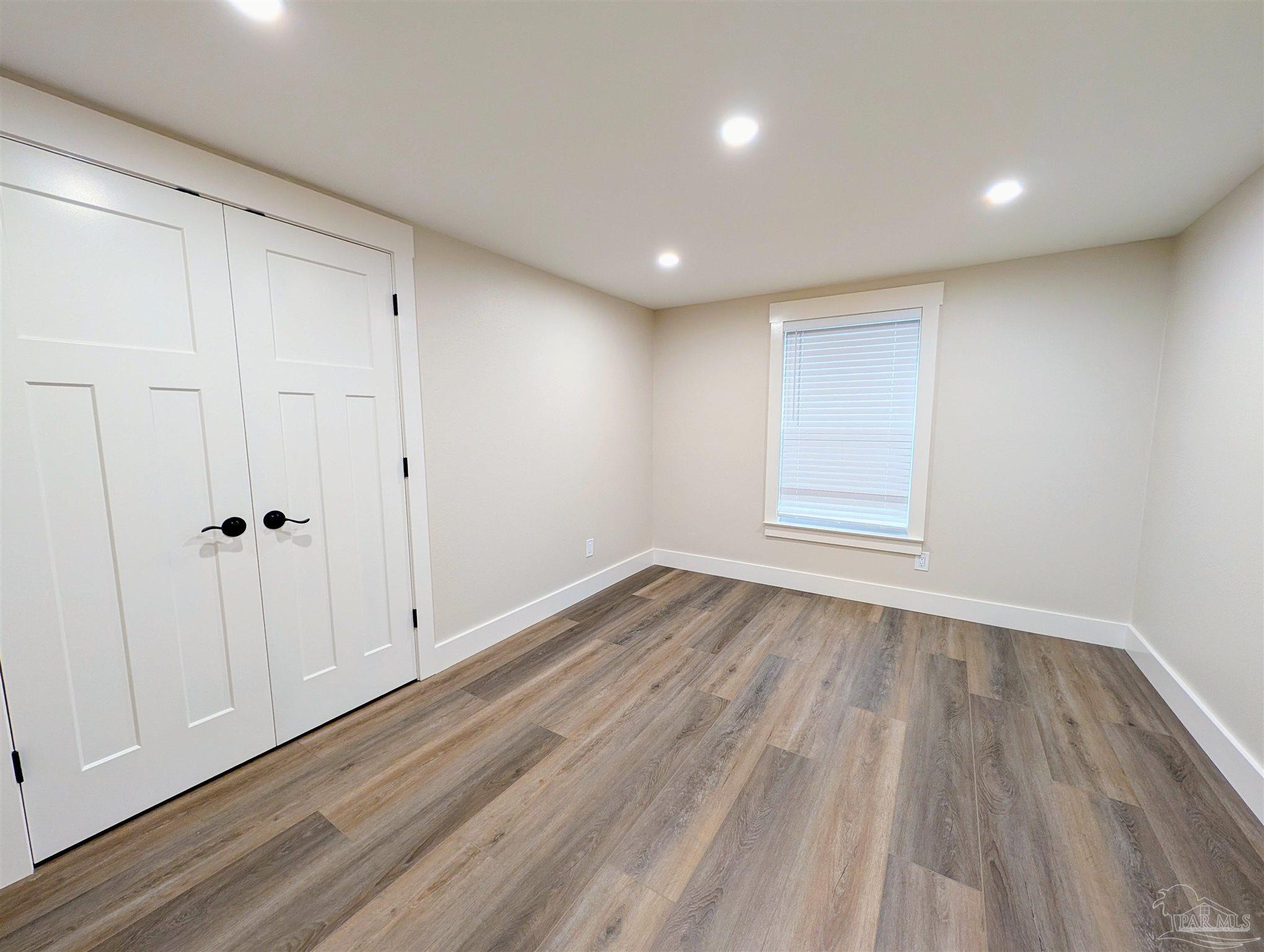 222 Santa Rosa Road Cantonment, FL 32533 - Photo 25 of 48 a view of empty room with wooden floor