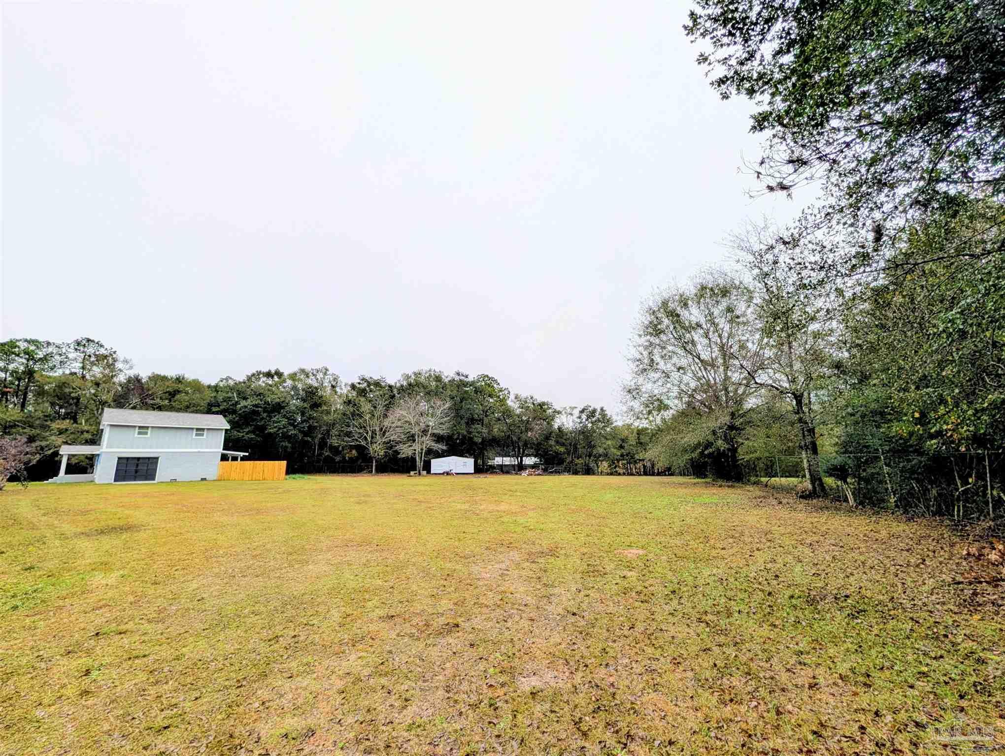 222 Santa Rosa Road Cantonment, FL 32533 - Photo 33 of 48 a view of a swimming pool with an ocean view