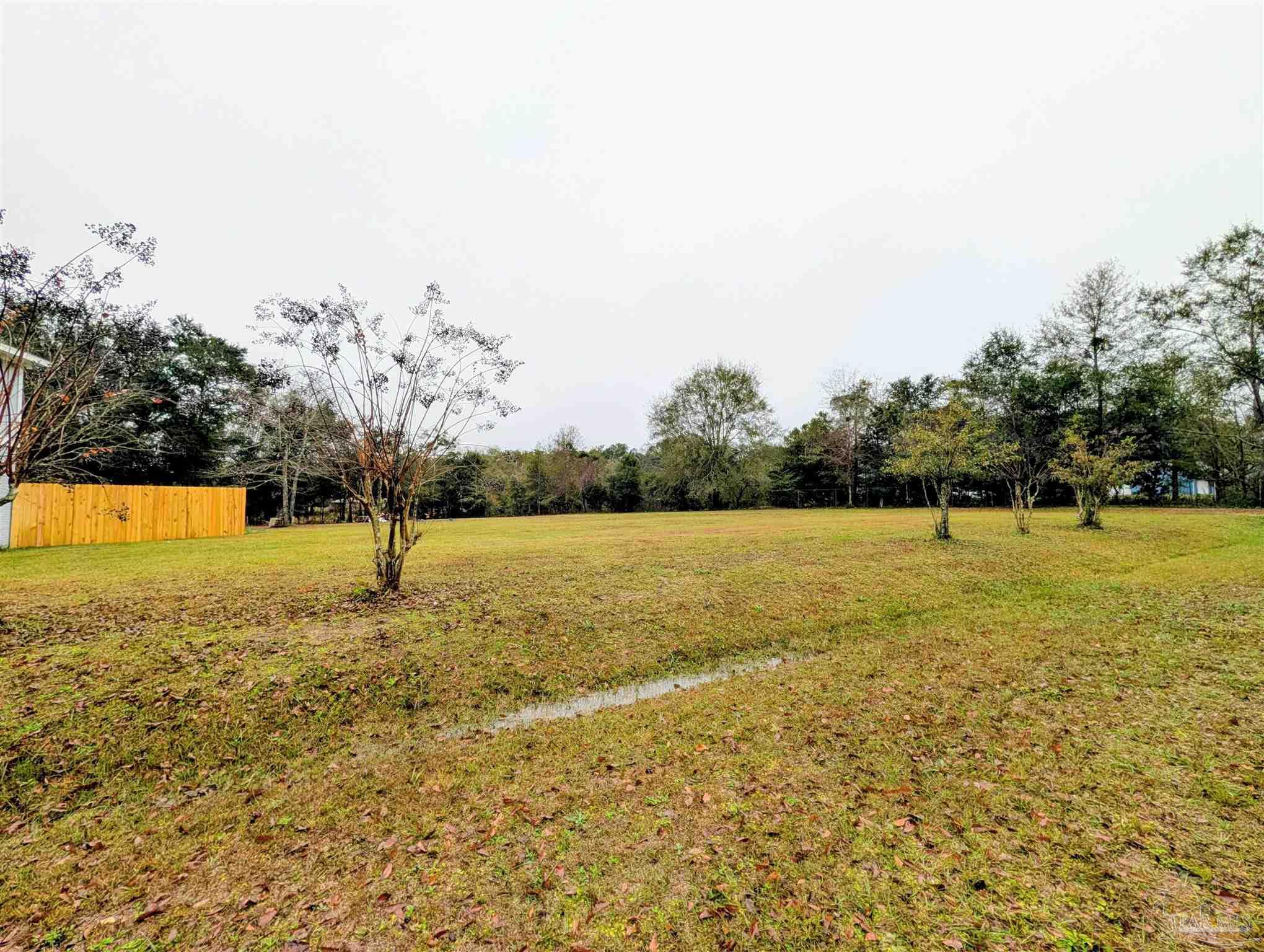 222 Santa Rosa Road Cantonment, FL 32533 - Photo 39 of 48 a view of a yard with a lake view